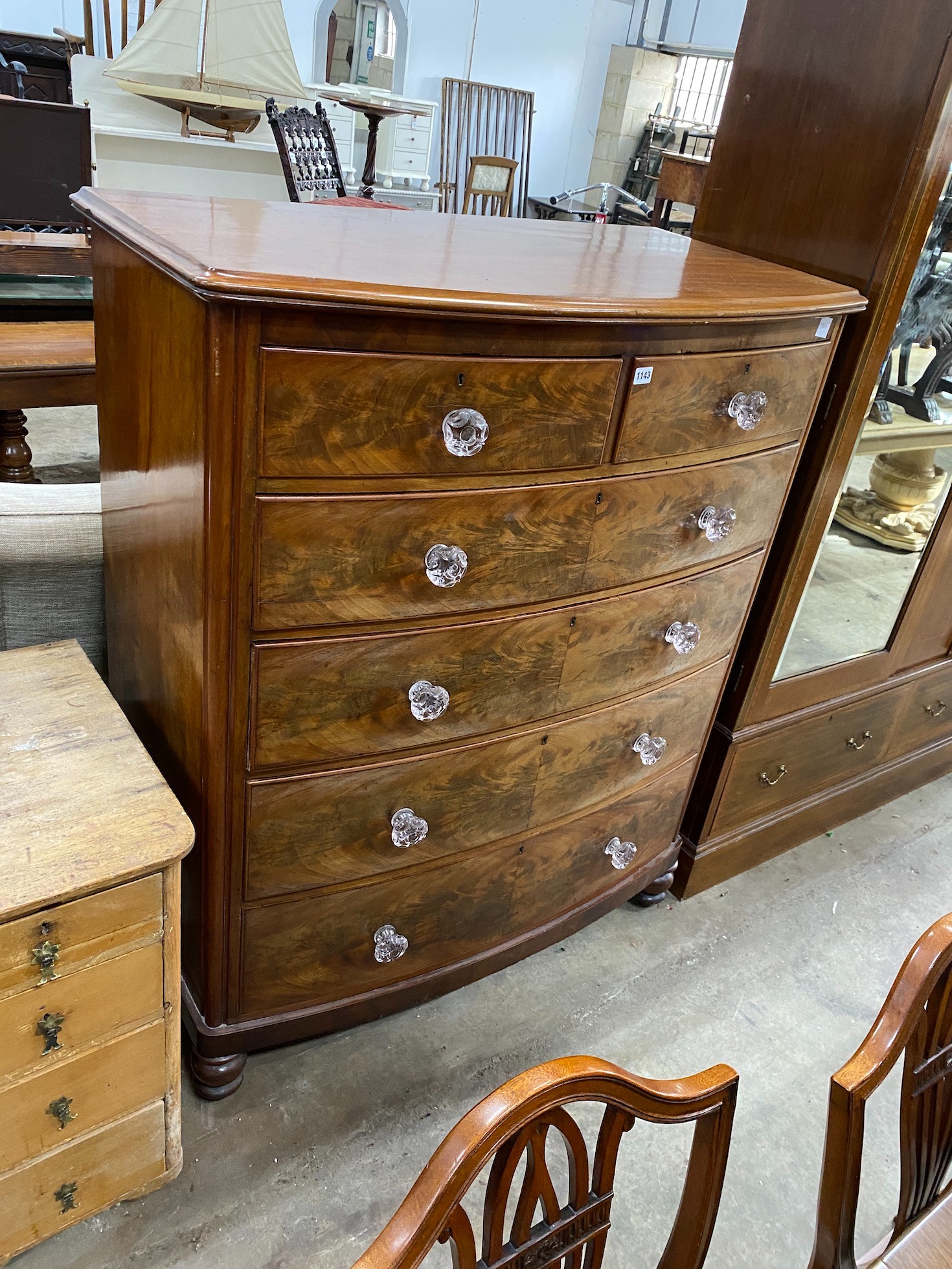 A Victorian mahogany bowfront chest with moulded glass handles, width 114cm, depth 60cm, height 141cm